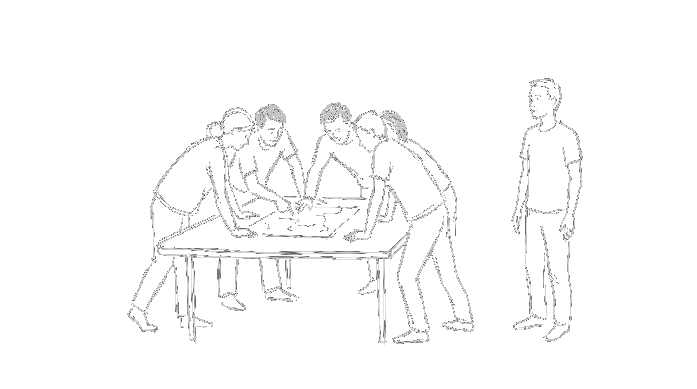 A team gathered around a table with one person standing apart, watching