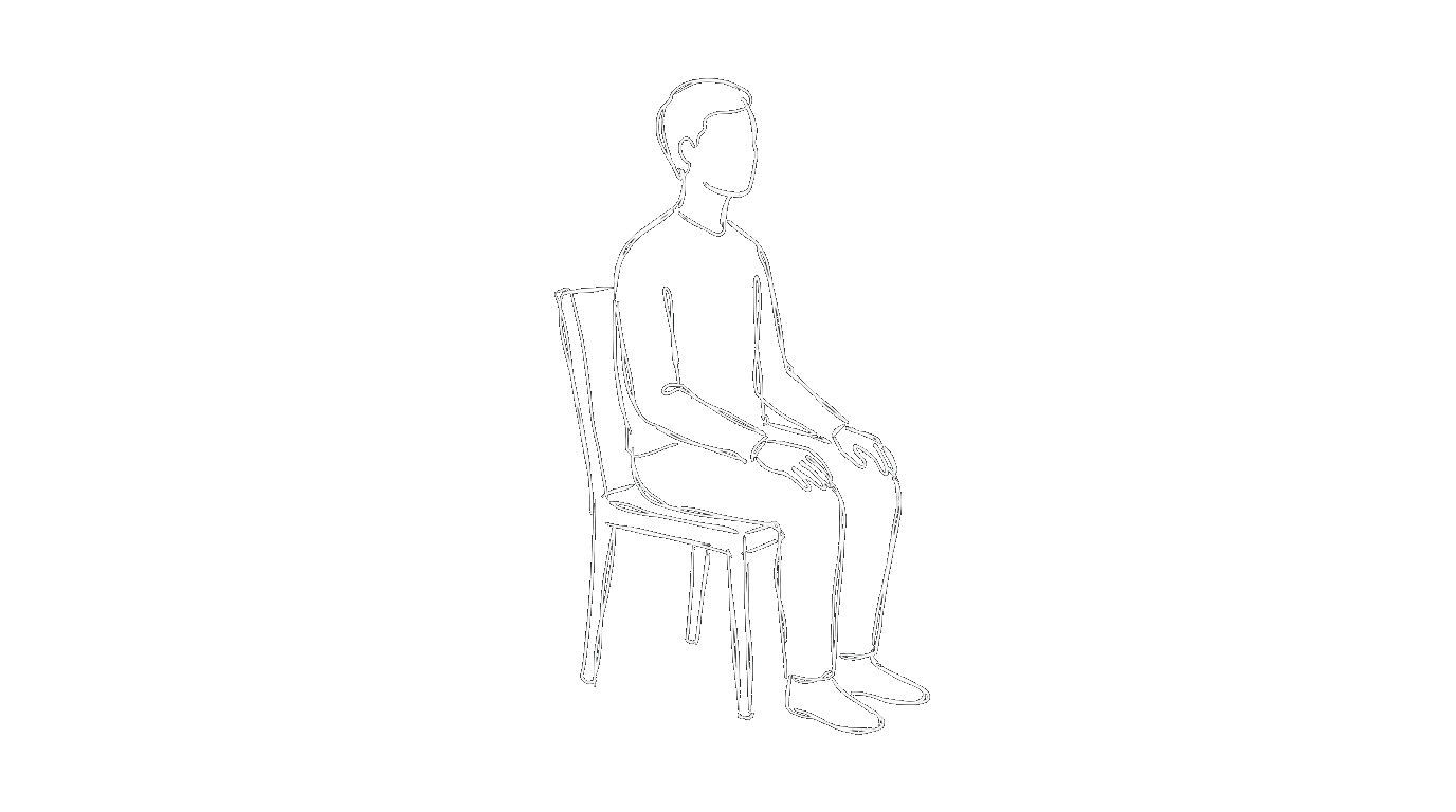A person sitting quietly on a chair, looking ahead
